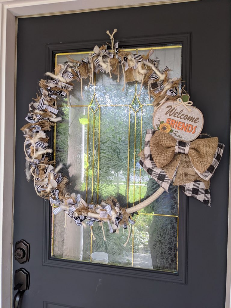 farmhouse rustic rag wreath on a dark gray front door