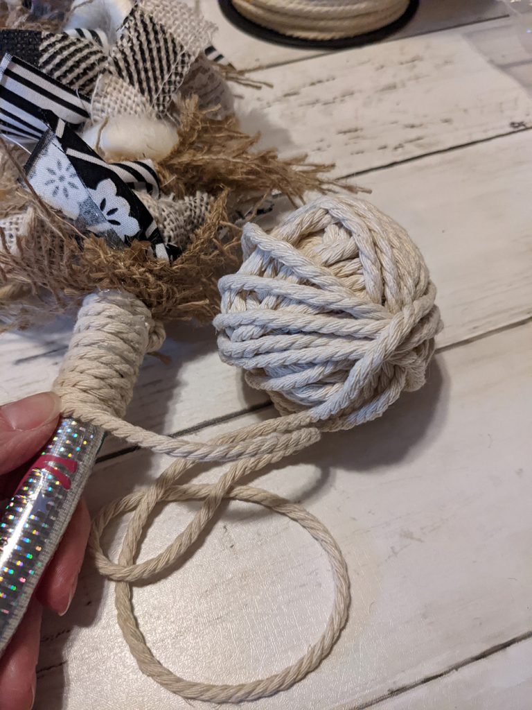 rope being wrapped tightly around a hula hoop
