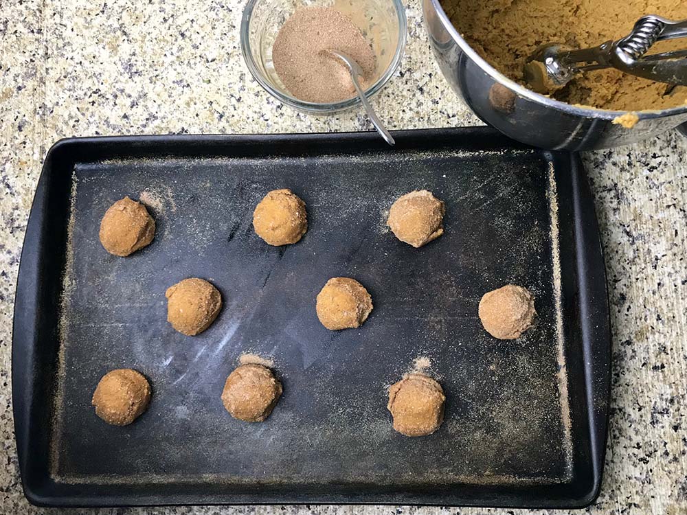pumpkin spice cookie dough on a baking sheet